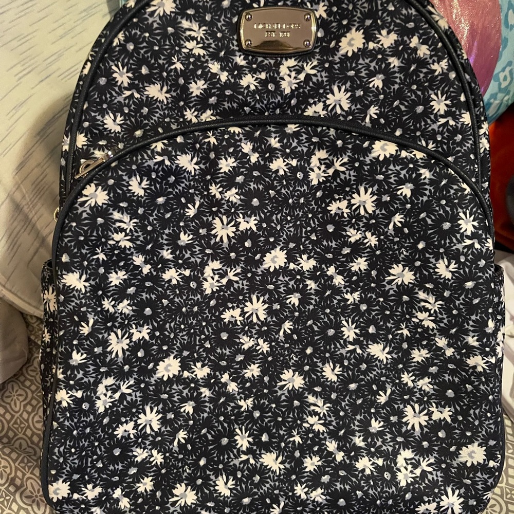 Only use a couple times beautiful white and blue Daisy Michael Kors backpack
